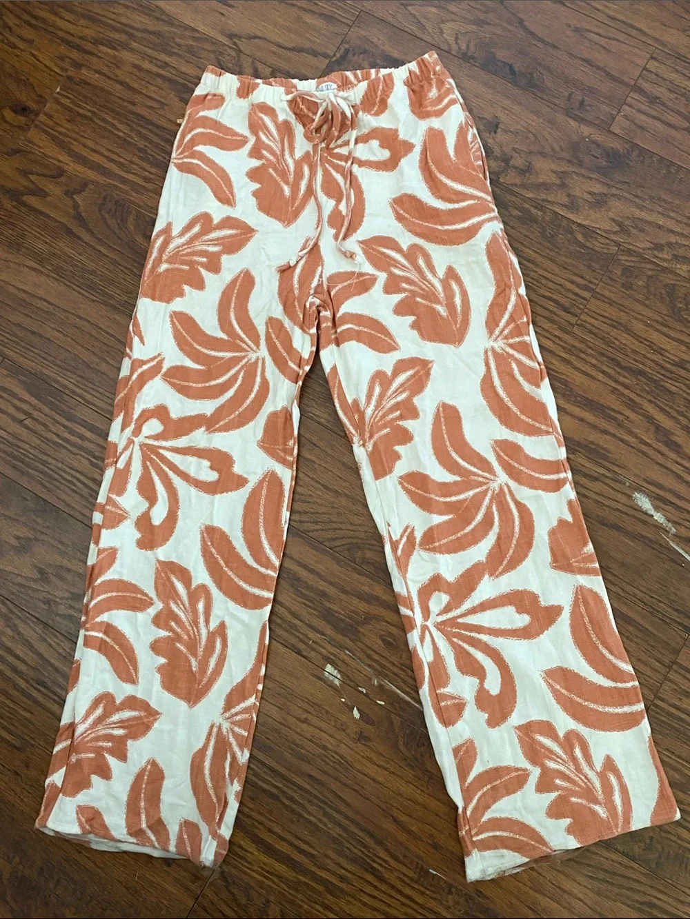 Sienna Sky Cream and Orange Floral Wide-Leg Pants